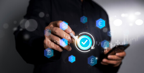 Global currency exchange and money transfer concept, businessman touching virtual world map and currency symbols including dollar, yuan, yen, euro and pound sterling.