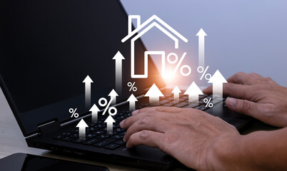 Real estate investment ideas Man using laptop touching virtual house icon to analyze home loan and...