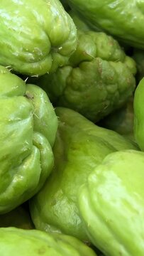 Fresh vegetables Chayote. Chuchu. vegetables and fruits on the counter in a supermarket or market in Vietnam High quality 4k footage