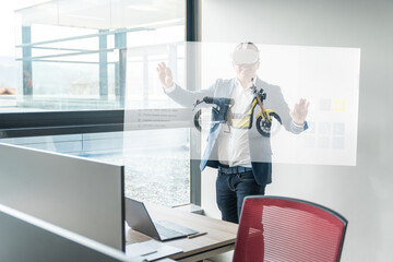 Businessman with augmented reality goggles touching interactive screen