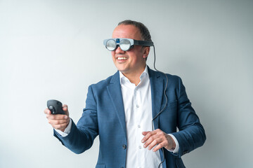 Businessman using mixed reality goggles and remote control