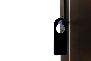 A black door hanger is hanging on a white door. The door hanger is smooth and has a beveled edge....