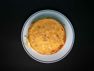 Delicious Vegetable Omelette, Colorful and Healthy on White Porcelain Plate