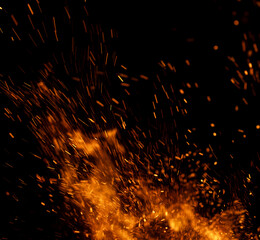 fire flame with sparks on black background.