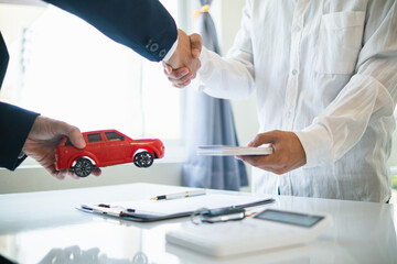 Car dealers are offering promotions to customers and calculating the cost of leasing a new EV car....