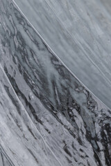 Smooth glassy texture of frozen ice abstract background