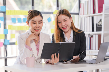 Portrait of success Asian business people working together in home office. Couple teamwork startup concept