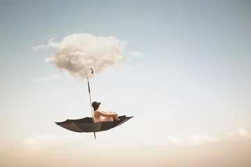 Fotobehang surreal umbrella carried by a cloud takes a woman to the sky, abstract concept © Cristina Conti