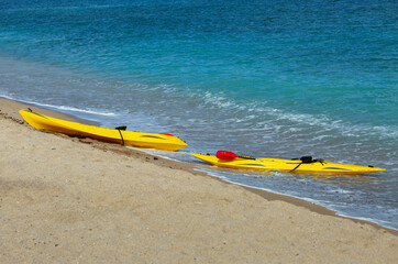 two yellow kayaks on the Mediterranean coast