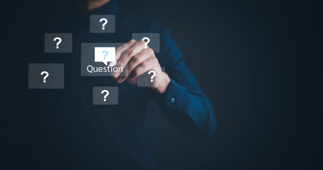 Ask question online concept, Businessman hand hold interface question marks sign web, Question...