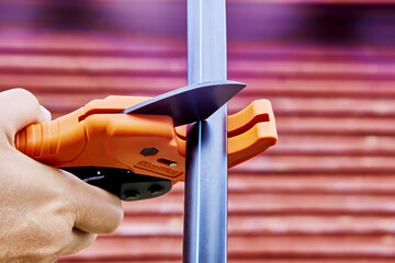 Ratcheting pipe scissor cutter is used when installing drinking and irrigation water pipes, plumber...