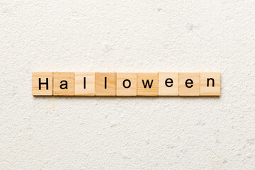 halloween word written on wood block. halloween text on table, concept