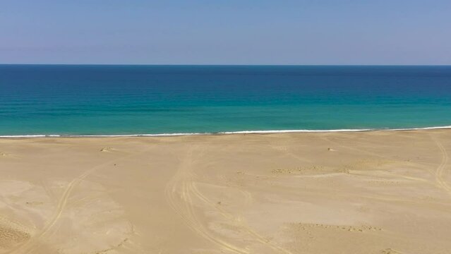 Beautiful sea landscape beach with turquoise water. Paoay Sand Dunes, Ilocos Norte, Philippines.