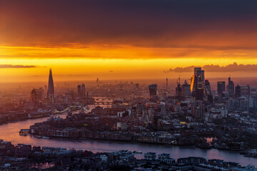 Panoramic view of a golden sunset behind the urban cityscape of London, England