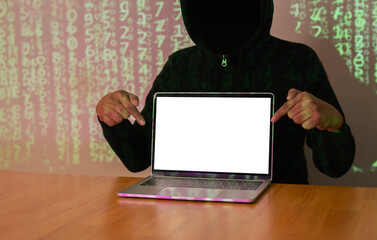 Dark face hacker pointing hands and show laptop while stealing big data and finance information.