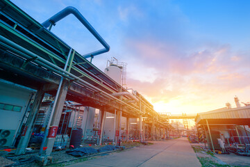 Oil and gas refinery plant or petrochemical industry on sky sunset background, Factory with...