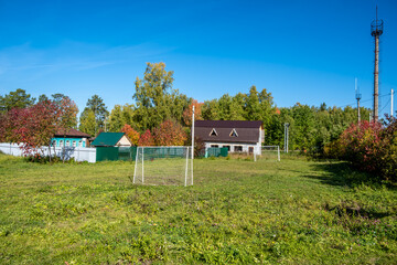 A football field in the village on a summer day.