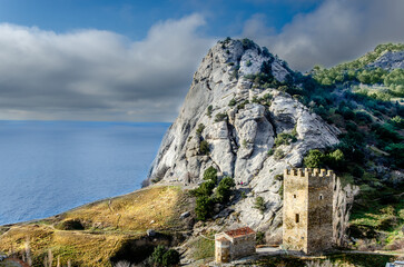 A fortress near a cliff on the seashore.