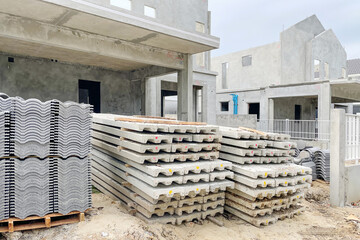 Construction site of property projects during construction show precast housing structure with roof and floor materials. Image use for real estate development presentation background.