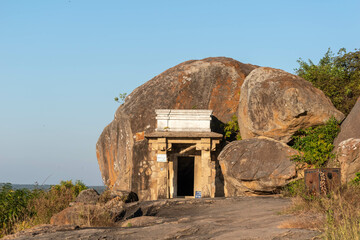 Ancient Rock-Cut Cave Temple in Shravanabelagola Captured During a Bright Daytime