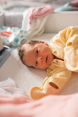 Obraz na płótnie Canvas Newborn baby. A newborn baby lies in the maternity hospital.