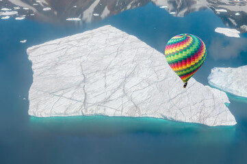 A giant piece of iceberg has broken away from the Glacier - Hot air balloon flying over A giant...