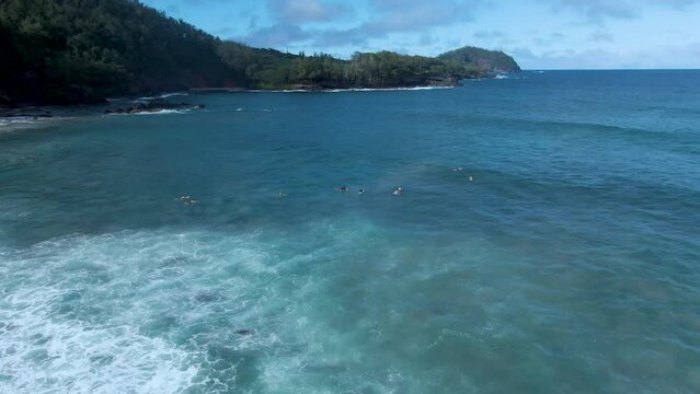 Aerial view of Group of Surfers Waiting for waves in Koki Beach beautiful landscape, Maui. Hawaii