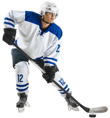 Concentrated young man, hockey player in uniform standing with stick on nice rink against transparent background. Concept of professional sport, competition, game, tournament, match, action © Lustre Art Group 