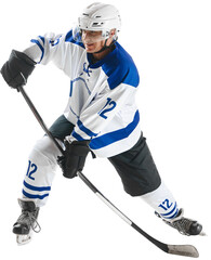 Man, hockey player with stick and puck, playing, training on rink against transparent background Concept of professional sport, competition, game, tournament, game, action, motion, championship, match