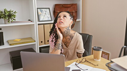 Stressed hispanic business woman, a defiant arm amputee, overworked at office job, struggles with...