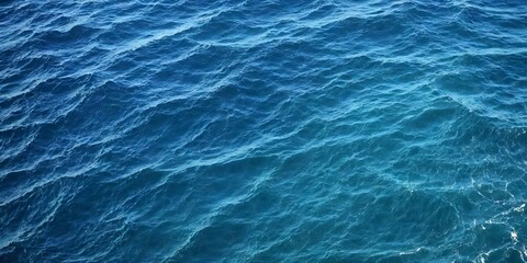 Blue sea water texture. Water splashing in the deep sea.