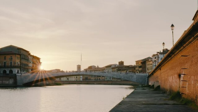 Arno River and Ponte di Mezzo, Lungarno Boulevard at sunset in Pisa, Tuscany, Italy