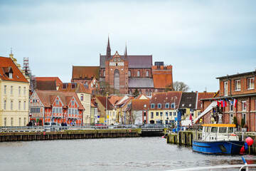 Harbor in the old town of the hanseatic city of Wismar, view on historic houses and the red-brick...