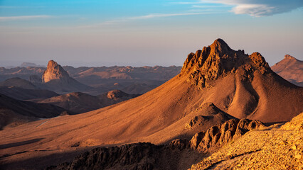 Hoggar landscape in the Sahara desert, Algeria. A view from Assekrem of the mountains and basalt organs that rise up in the morning light.