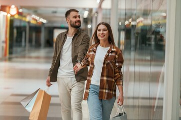 Happy people. Young couple are in supermarket together