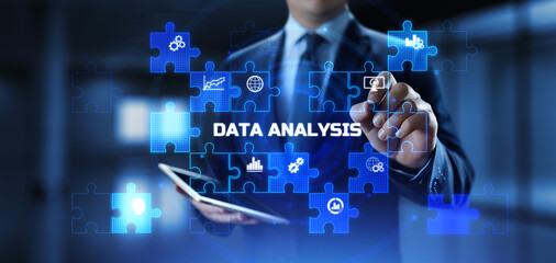 Fototapeta premium Businessman pressing virtual button data analysis text on screen.