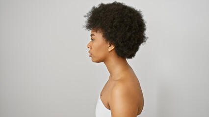 Portrait of a beautiful african american woman with curly hair against a white isolated background