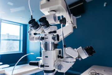Interior of a modern ophthalmology operating room with modern equipment. The concept of new ophthalmological and modern technologies for vision correction and treatment. - obrazy, fototapety, plakaty