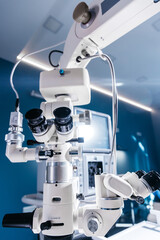 Surgical microscope in the operating room of a modern ophthalmology clinic with high-quality...