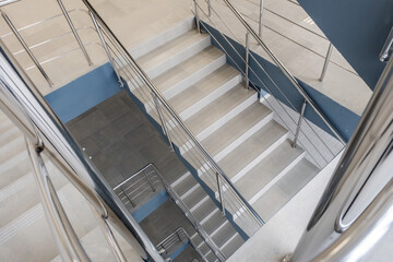 emergency and evacuation exit stairs  in up ladder in new empty office building