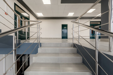 emergency and evacuation exit stairs  in up ladder in new empty office building