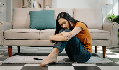 woman sit Depression Dark haired  pensive glance Standing on sofa  by window