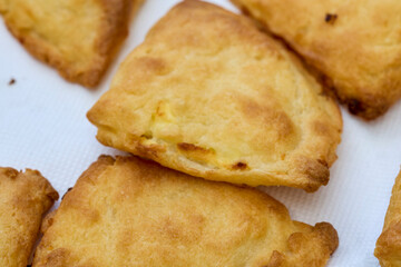 close up with mini patties with cheese.