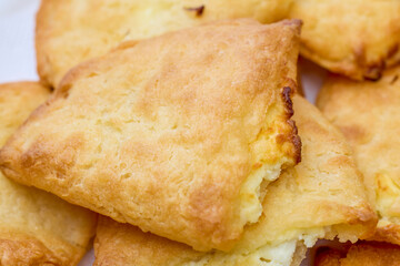 close up with mini patties with cheese.