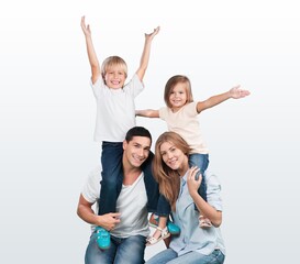 Obraz premium Happy young family posing with child