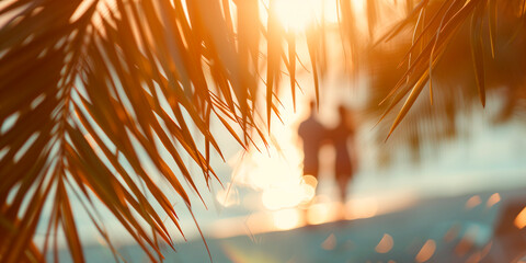 Blurred background silhouette of a romantic couple in romantic or honeymoon trip , framed by palm leaves - obrazy, fototapety, plakaty