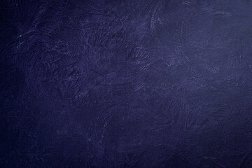 Violet background with an imitation of a cement surface. beautiful texture decorative Venetian stucco for backgrounds. Top view. Free space for text.