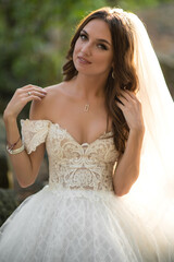 Portrait of beautiful bride in white wedding dress