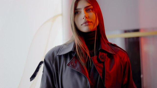 The woman with red, long hair wearing a black leather jacket and a black turtleneck at the entertainment event has bangs and layered hair