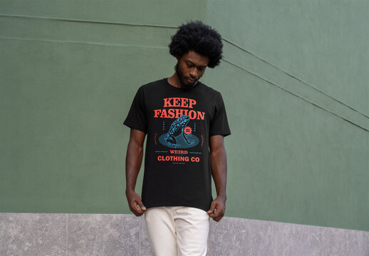 Mockup Of Man By Wall Wearing Customizable T-shirt